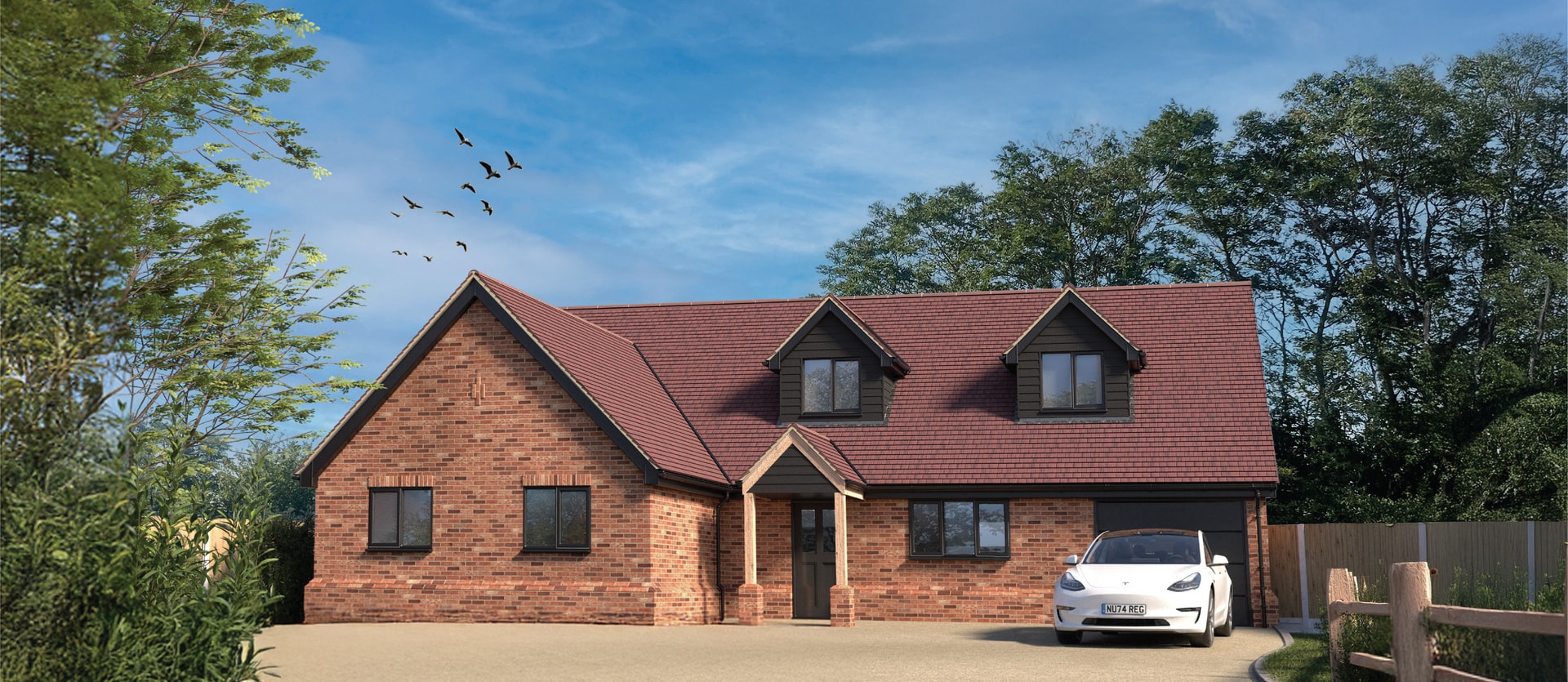 Computer-generated image of a brick chalet bungalow at Writers Mews, with dormer windows, an oak porch and a gravel drive.