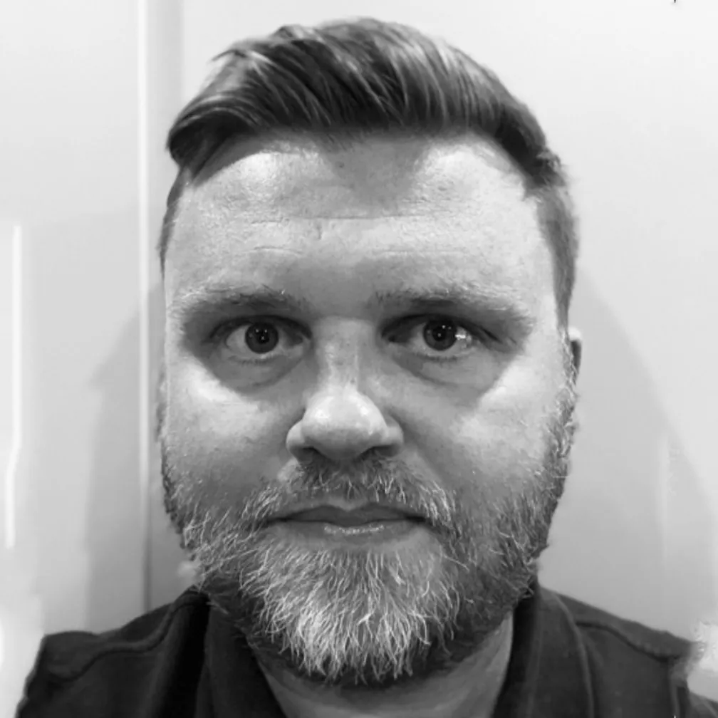 Adam Beckford, company director of Pyrmont Homes, in a black and white portrait.